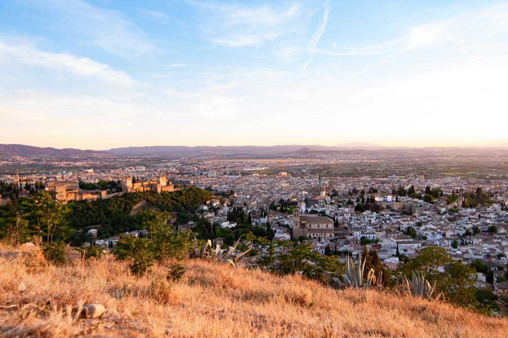 Views of the Alhambra and Albaicin at sunset from the San Miguel Alto Viewpoint, Granada.